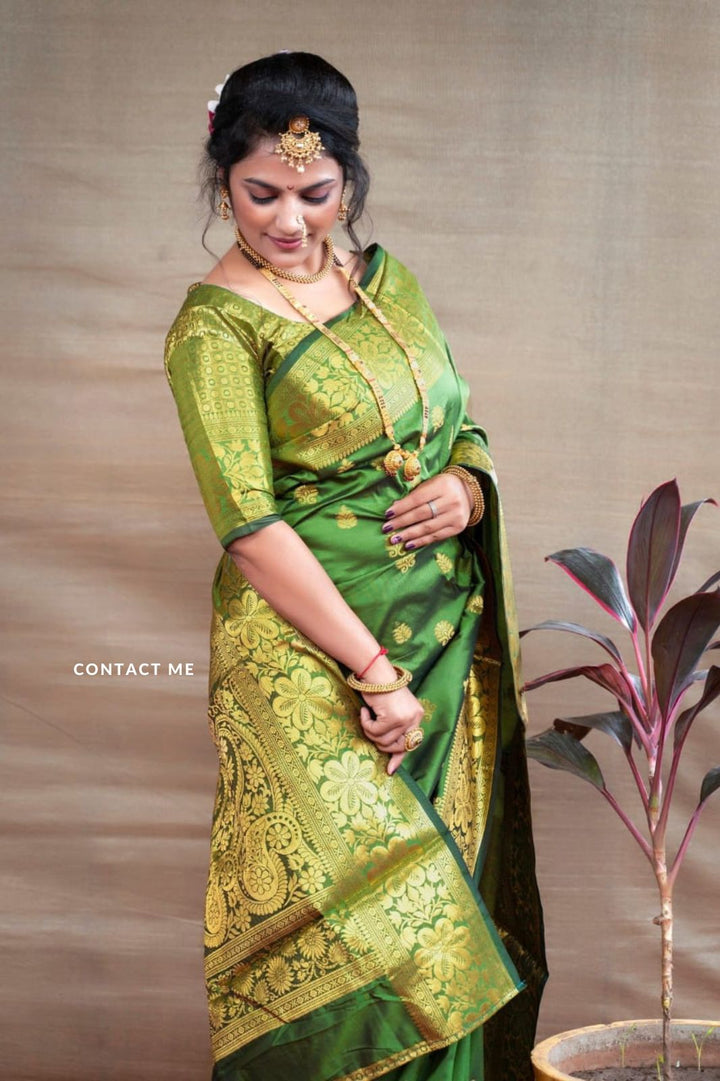 Preferable Green Banarasi Silk Saree With Blouse Piece