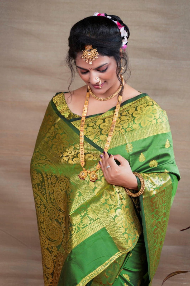 Preferable Green Banarasi Silk Saree With Blouse Piece